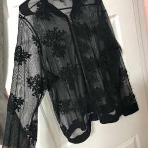 Sheer black lace jacket.